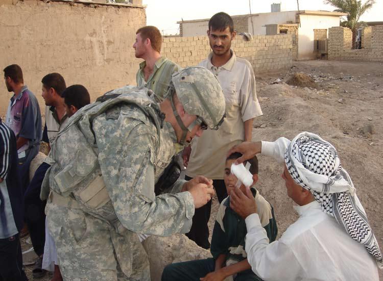 winning respect A medic attached to the unit provides medical care for an Iraqi child. U.S. Army photo. Providing quick-impact projects to jump-start local economies.