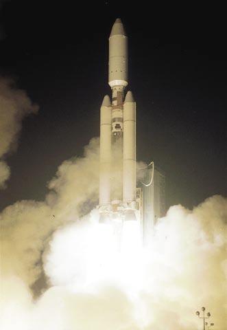 Below, on April 29, 2005, Mission B30 is a go, and the Titan s fiery blastoff shakes the earth