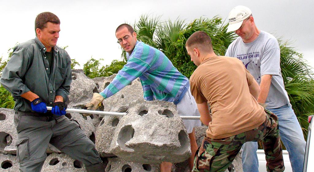 MacDill Oyster Domes Volunteers unload marine-friendly concrete oyster domes prior to being placed in the near-shore water along MacDill AFB s southeastern shoreline as part of a long running
