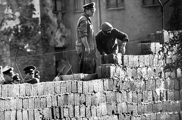 Berlin Wall In August 1961, Khrushchev responded by building a wall to separate Communist East Germany and non- Communist