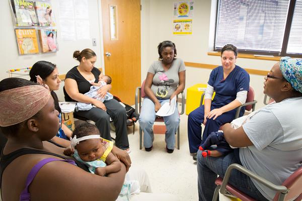 (Photo credit: Mark Tuschman; Erika Lansner) Pregnant women meet to discuss issues relating to their pregnancy and receive