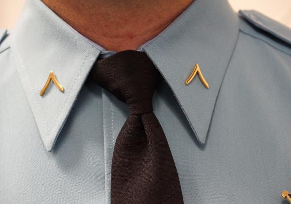 3.03.015 Collar Devices Rank insignia will be worn on shirt collars. Insignia will be positioned on shirt collars; centered 1½ inches from the tips of the collar.