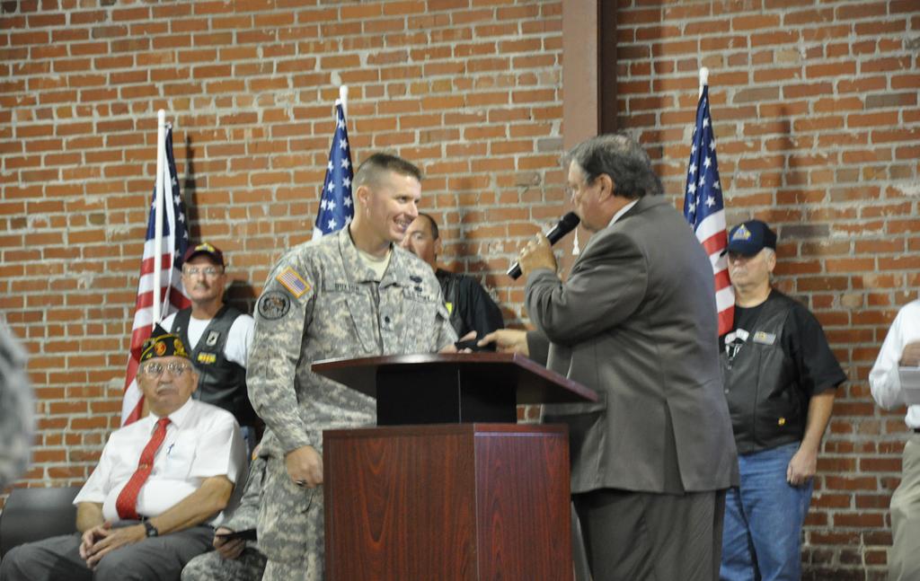 4 Alabama Guardsman Snap Shots A look at some of the recent highlights in the Alabama National Guard Dan Williams, mayor of Athens, offers the key to the city to the 203rd Military Police