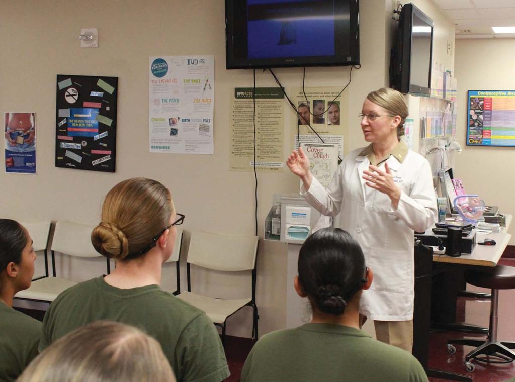 Military service and motherhood are enjoyable and completely compatible when adequately planned. - Cmdr. Dixie Aune Cmdr. Dixie Aune provides information about contraceptives to female recruits.