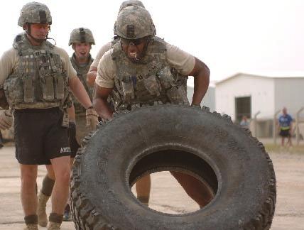 Paratroopers take part in combat athlete competition Staff Sgt. Tony White 5th MPAD SAMARRA, Iraq - Spc. Eric Fair sprints down the landing zone carrying an M-2.