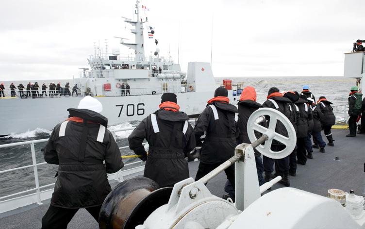 Naval reservists aboard HMCS Edmonton let a line out to HMCS Yellowknife while conducting a resupply. Photo: Cpl Andre Maillet This is our challenge as reservists in a Naval Reserve Division.
