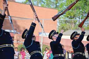 Above, drill master Christain Stokes, takes his mark and led