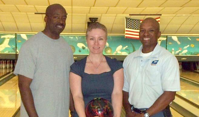 Photo courtesy MacDill Lanes (Left to right) Charles Comer, Sheila Woodruff, Carl Woodruff, members of the 6th Medical group and top finishers in the bowling tournament.