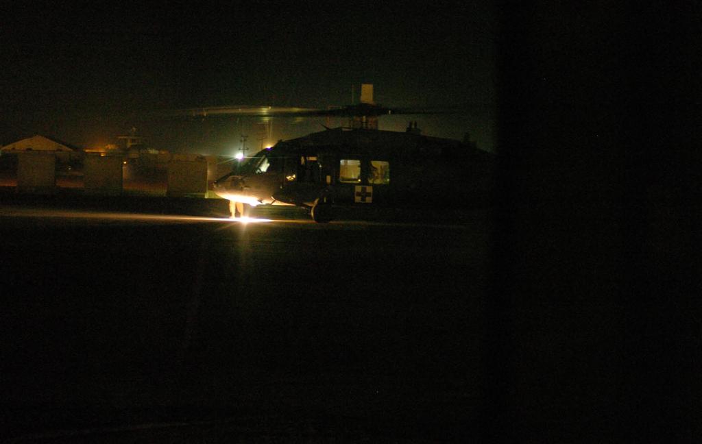 right A UH-60 MEDE- VAC aircraft from the 57th Medical Company sits on the pad at Abu Ghraib Prison to transfer a patient to another