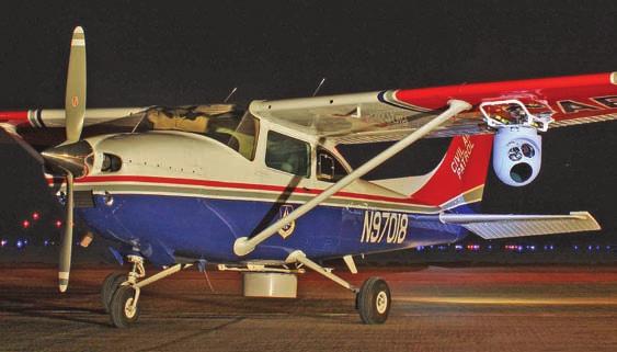 A Predator sensor ball mounted underneath the left wing of this CAP Cessna 182 turns the aircraft into a Surrogate Predator suitable for predeployment training for American soldiers.