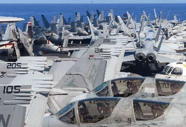 Aircraft jam a carrier deck earlier this year during a munitions offload. to 313 combatants.