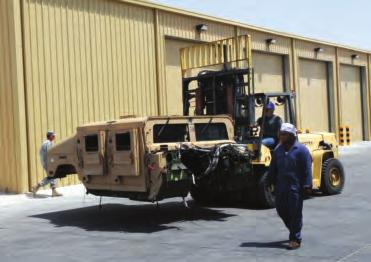 An HMMWV is transported outside a new 6,000-square-foot auto body repair facility at Camp As Sayliyah, Qatar.