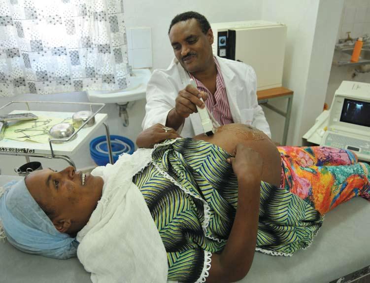 ETHIOPIA Building Health Systems A kind cut Garbed in theatre green, Dr Teshome Kassaye stands over a sink at the Awash Health Centre scrubbing up for a Caesarean section operation on a mother whose