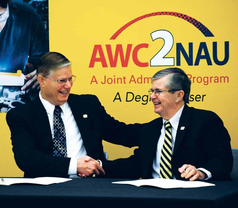 Arizona Western College President Glenn Mayle, left, and President Haeger celebrate the institutions 25-year partnership at NAU-Yuma during a rededication event in 2013.