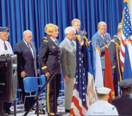 Commander Ray Waldron of Ch 60 leads the Pledge of Allegiance at Saratoga Springs event, as Mayor Scott Johnson and other dignitaries participate