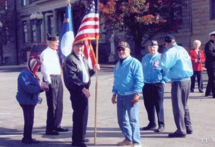 Laredo, TX 78043, 956-723-6978 Bystanders watch members of Ch 186 at Memorial Day ceremony: Bob Osborn (holding