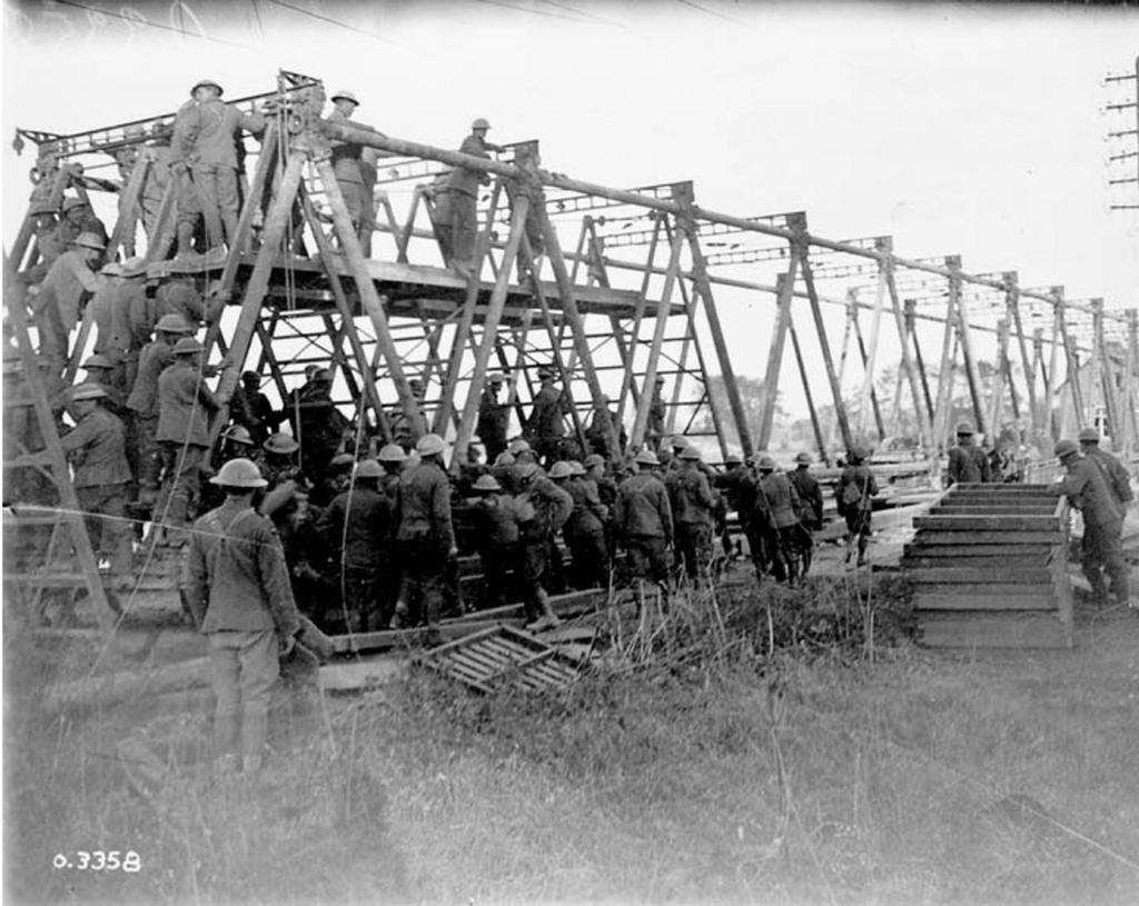 7 of 12 08/03/2014 2:20 PM Canadian troops constructing a bridge across Canal-du-Nord, September 1918.