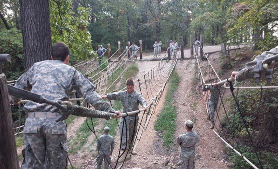 Right: Cadets are shown navigating a teambased rope bridge obstacle during the 2015 Fall Leadership Development Exercise at Fort Leonard Wood, Missouri.