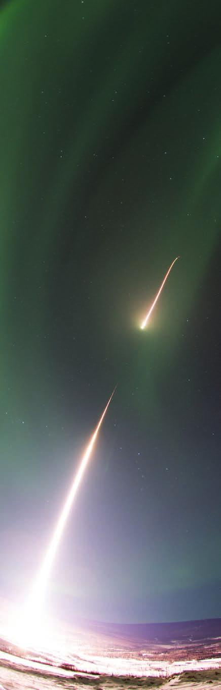 A NASA Black Brant IX sounding rocket soars skyward into an aurora over Alaska following a Feb. 22, 2017 launch.