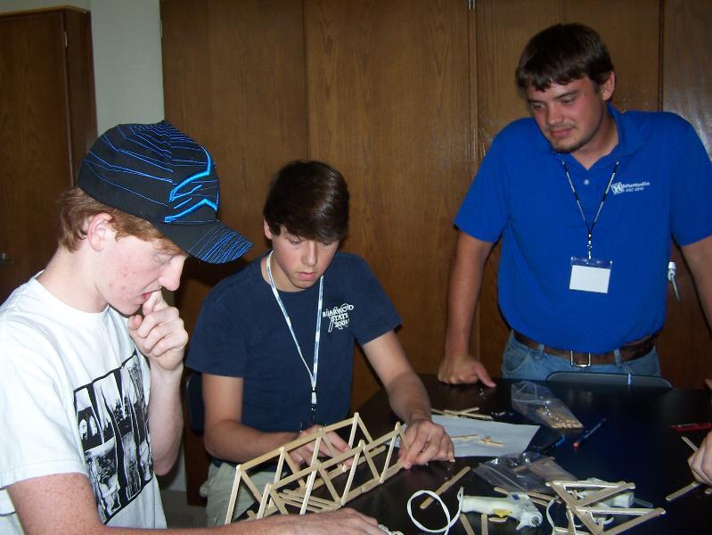 MAE Undergraduate Student Adam Martin provides guidance to Engineering Camp students.
