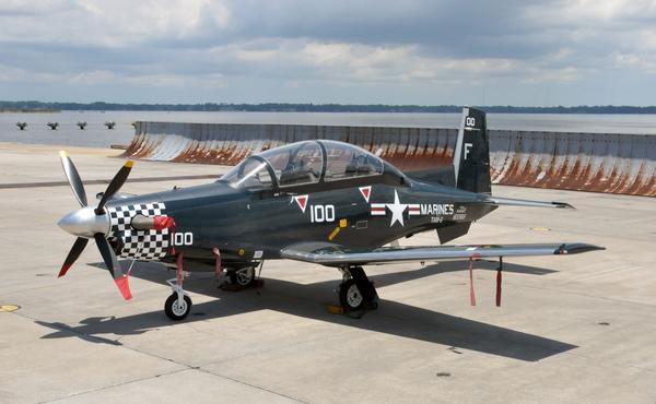 A Hawker Beechcraft T-6A Texan II Turboprop Trainer aircraft used to train Navy and Marine Corps pilots and Naval flight officers sits near the seawall at Naval Air Station Jacksonville, Fla.