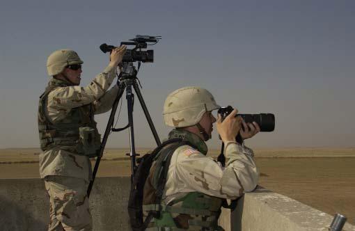 Chapter III 139th Mobile Public Affairs Detachment journalists attached to Task Force Olympia document a live fire exercise at Range Destiny in Mosul, Iraq, June 7, 2004.