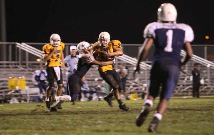 the Beast, breaks a tackle and runs for a 7-yard gain during the semi-final game in the 2010 Camp Pendleton Football League against the School