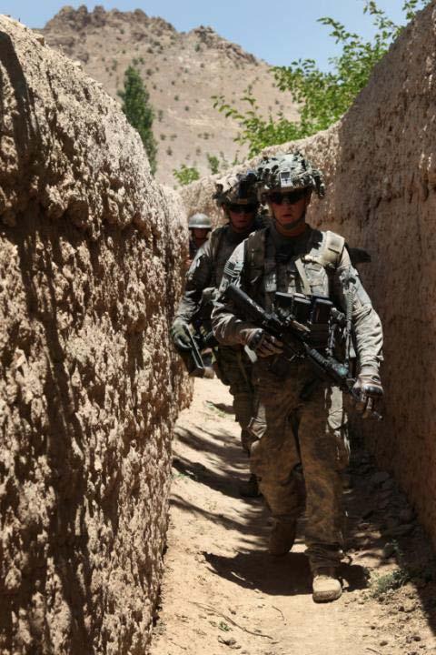 U.S. Army Cavalrymen from Bulldog Troop, 1st Squadron, 91st Cavalry Regiment, 173rd Airborne Brigade Combat Team as well as an Afghan National Army soldier; travel through a trail system surrounded