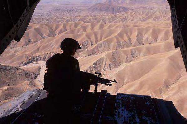 A Chinook rear gunner surveys the dangerous terrain between Kabul and Jalalabad.