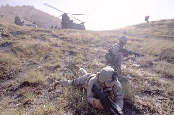 U.S. Marines and Navy corpsmen fan out from a CH-47 in Kunar Province, Afghanistan, on a 2005 operation to find a Taliban mortar position.