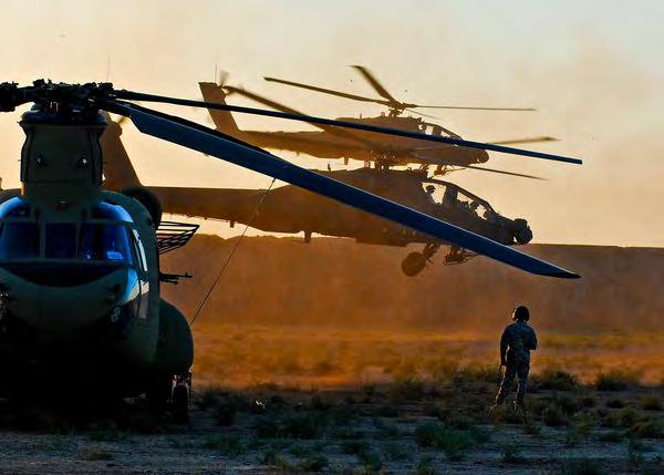 (Ed Darack ) Extortion 17 was accompanied by two AH-64 Apaches, like the pair lifting off behind a CH-47, as well as an AC-130 and UAVs.