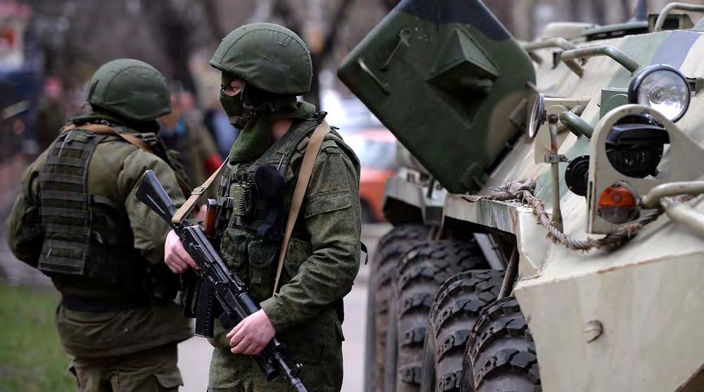Filippo Monteforte/AFP/Getty Images Russian soldiers patrol outside the navy headquarters in the Crimean Peninsula city of Simferopol on March 19, 2014, the day after the Russian Federation annexed