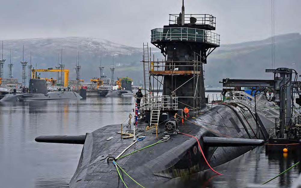 Jeff J. Mitchell/Getty Images Royal Navy security personnel stand guard on HMS Vigilant at Her Majesty s Naval Base, Clyde on January 20, 2016, in Rhu, Scotland.
