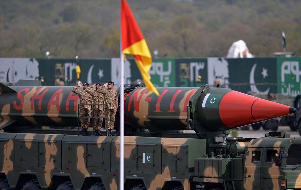 Aamir Qureshi/AFP/Getty Images Pakistani army soldiers salute as they travel on a vehicle carrying Shaheen III ballistic missiles during the Pakistan Day military parade in Islamabad on March 23,