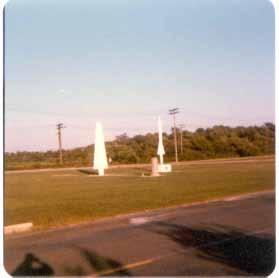 12 Top: View of Guardian Park from the east shows the Nike Hercules without its nose cone, and the monument without the concrete missiles, dating the picture to c. 1979-1981.