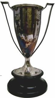 1 Silver plated trophy mounted on a black finished wooden base; 2 handles; gold plated burning torch medallion Frederick Funston Post No.