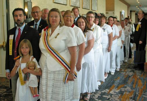 They were accompanied by their daughter, Emelia (center). (ASUVCW Photo/Helen A. Granger) OFFICERS -- All in a row just moments before the Aug.