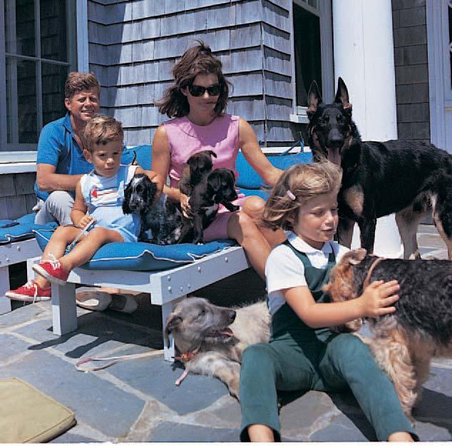 President and Mrs. Kennedy enjoy time with their children, Caroline and John, Jr., while vacationing in Hyannis Port, Massachusetts.