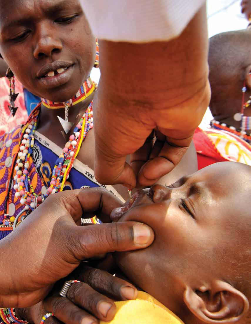 A child in Kenya receives a vitamin A supplementation capsule at a