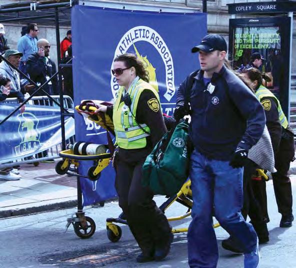same items they would bring to a routine medical call all the different medical bags piled on top of the stretcher with a monitor and oxygen bottle?