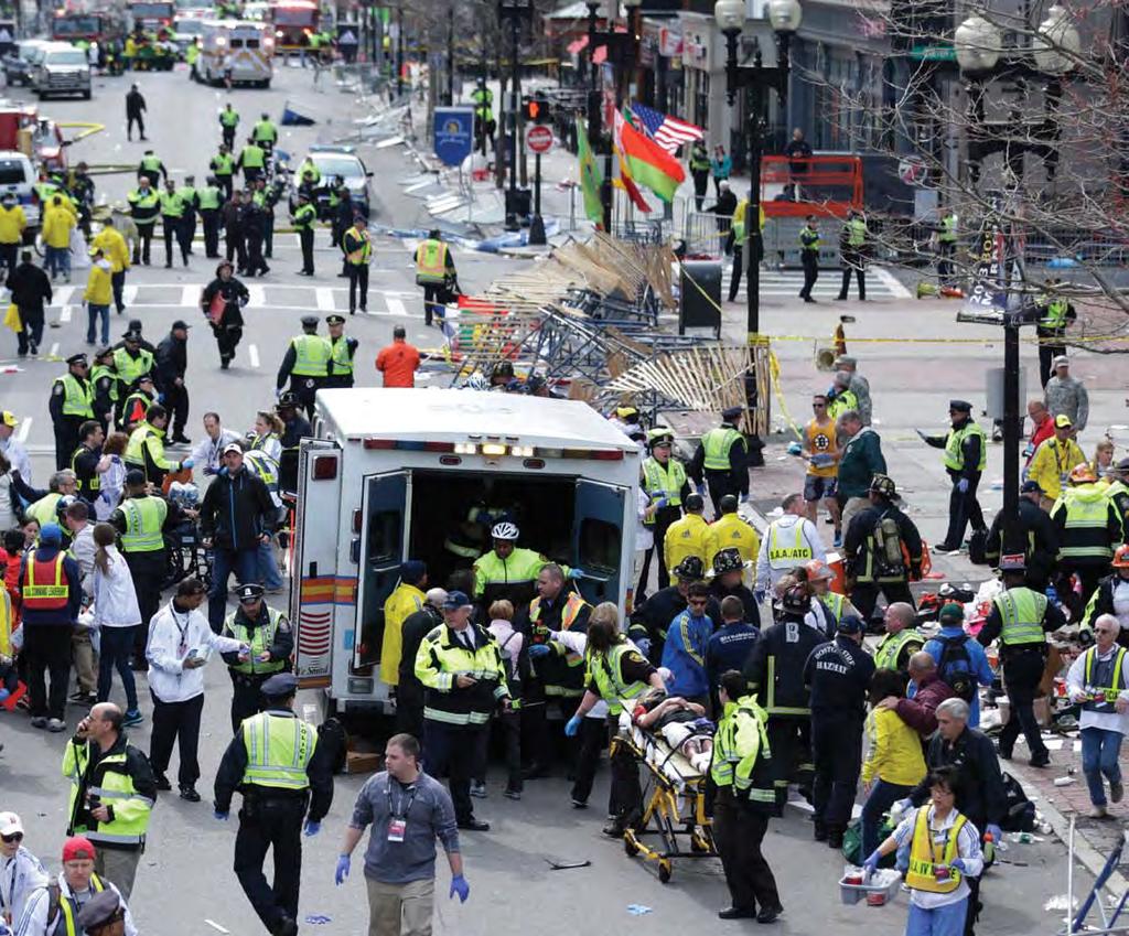 2013 Boston Marathon bombing scene on Boylston Street. AP Photo/Charles Krupa lost.