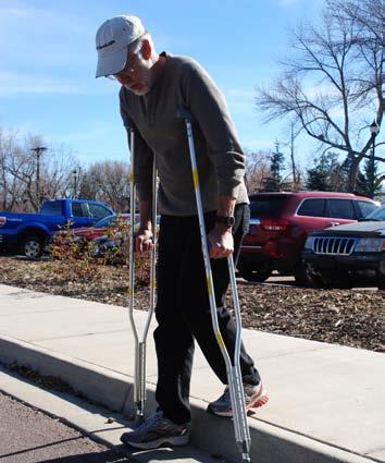 Stand close to edge of curb or step, place both crutches down securely. 2.