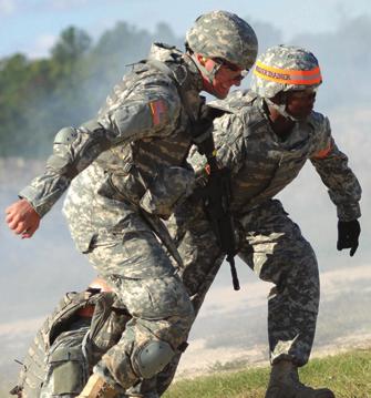 U.S. Army Medical Command s SPC Daniel Farrier moves a casualty along before engaging targets during the Department of the Army Noncommissioned Officer and Soldier of the Year Best Warrior