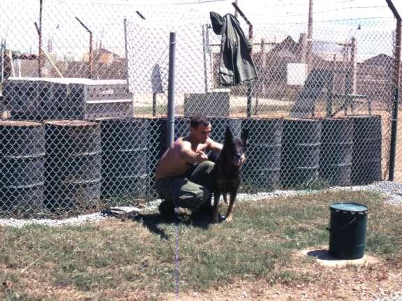 Sentry dog handlers The olive-drab five-gallon pail was the standard container for GI-issue dog food.