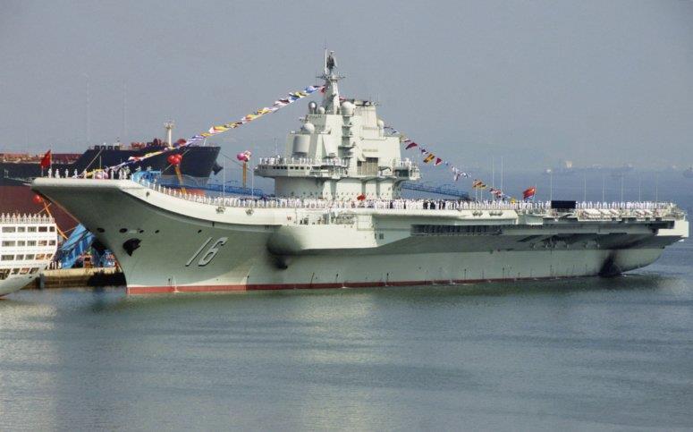 The People's Liberation Army Navy (PLAN) aircraft carrier Liaoning, seen here at Dalian shipyard on 25 September 2012 during its commissioning process.