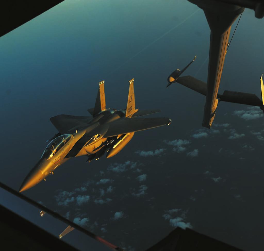 An F-15E pulls away after refueling from a KC-10 during a mission for Operation Odyssey Dawn.