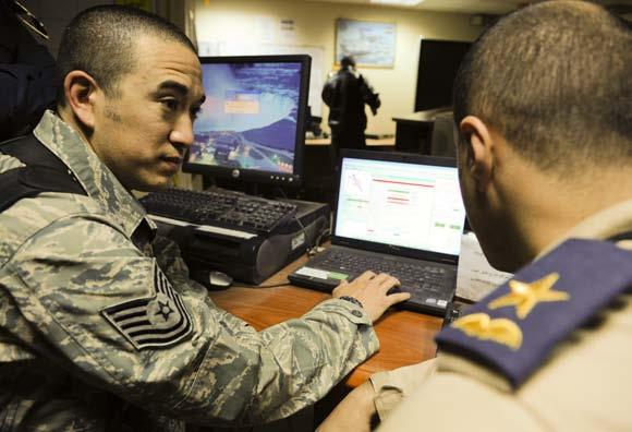 Operations Center, Baghdad, Jan. 13. Recent upgrades and training for the weather systems at the IAOC are part of an ongoing process to get the Iraq air force to a self-sufficient state. (U.S.
