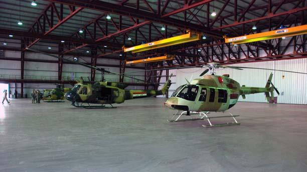 U.S. military turns over critical new facilities to Iraqi Aviation Command From left to right, a Gazelle, Huey and OH-58 Kiowa helicopter are showcased inside the $9.