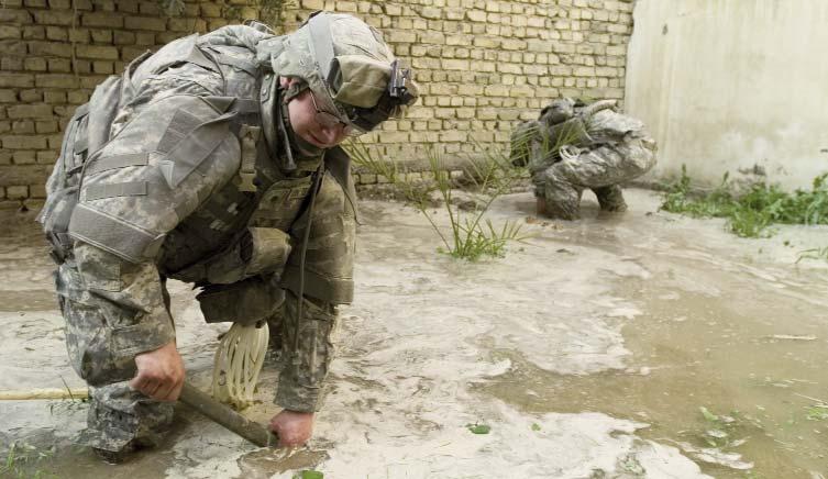 feet of water. Standing inside the wreckage of the house, his soaking wet boots dripping onto the shattered glass littering the floor, 2nd Lt. Travis Pride, of Asheville, N.C., had a theory.