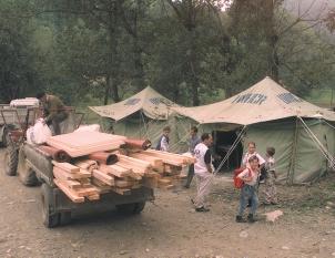 Hamblet and Kline Distributing relief aid in Kosovo, Joint Guardian. result of such undertakings as Restore Hope and Support Hope.